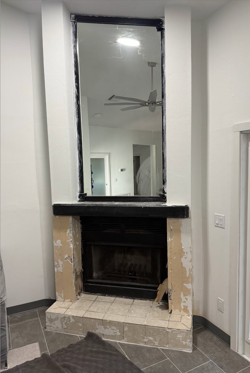 Wall recess before a custom white built-in cabinet and shelving unit was installed