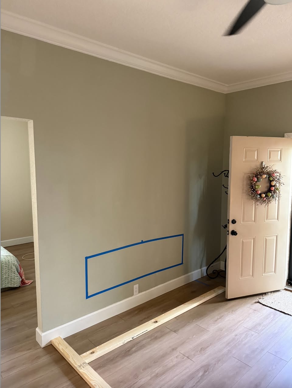 Blank living-room wall before a custom entertainment wall was built